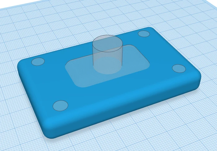 Before grouping: a blue plate with translucent hole shapes placed where the pocket and screw holes will go.