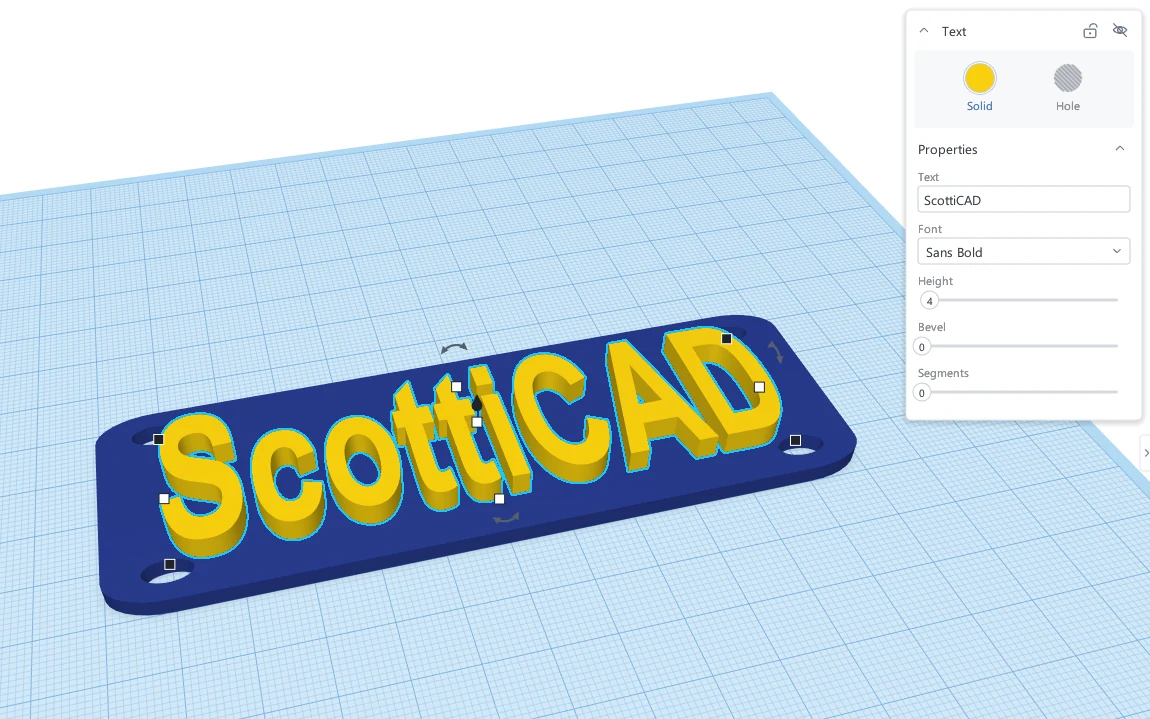 Yellow 3D text reading ScottiCAD sitting on a navy rounded plate, with the Text properties panel showing font, height and bevel.