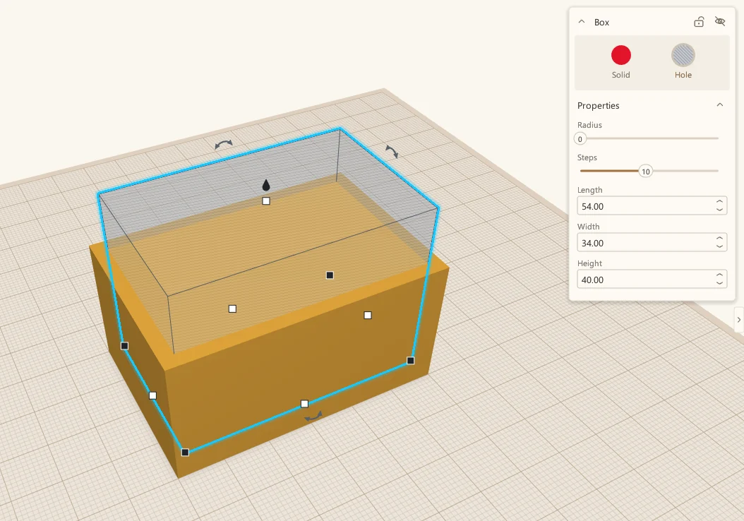 The see-through hole box sitting inside the outer box, selected, with its size in the panel: 54 by 34 by 40 mm.