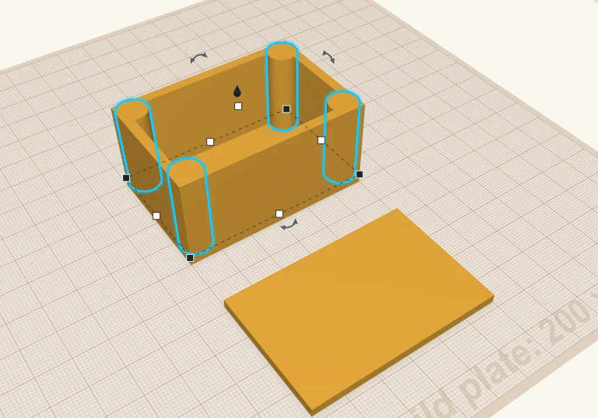 Four posts, one in each corner of the box, merged into the walls, with the lid beside the box.