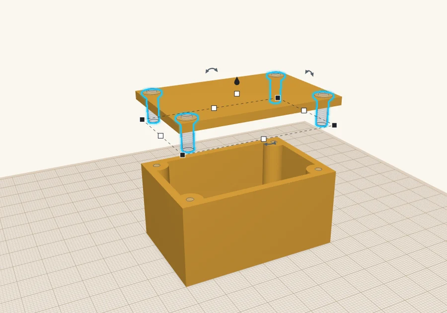 Four M3 countersunk-hole shapes in the lid, still lifted above the box.
