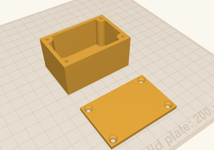 The finished project box, with a screw post in each corner, and its lid with four countersunk holes.