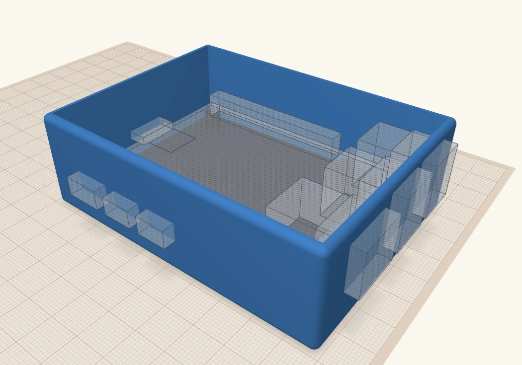A blue open-topped box with the Pi 5 mount sitting on its floor. The see-through ports of the board outline poke into the right-hand and left-hand walls.
